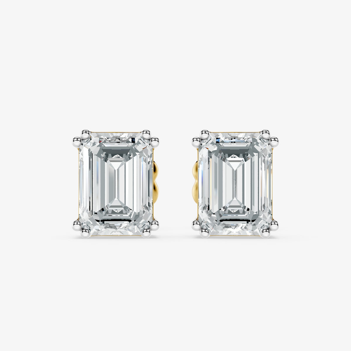 Classic emerald solitaire studs