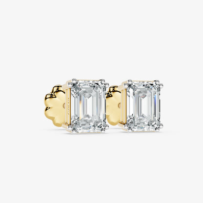 Classic emerald solitaire studs