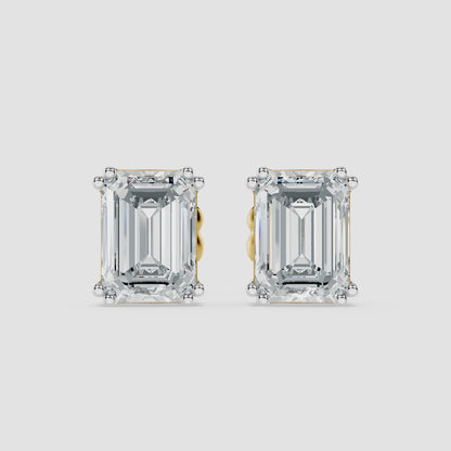 Classic emerald solitaire studs